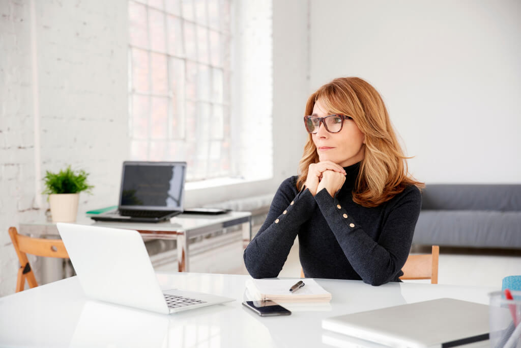 Professional woman sitting at desk